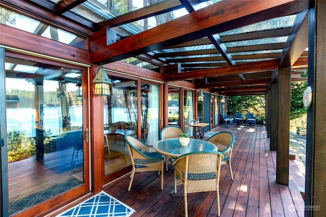 308 De Haro Ln, San Juan Island, WA 98250 - sunroom / solarium with beam ceiling, a deck with water view, and hardwood / wood-style floors