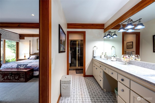308 De Haro Ln, San Juan Island, WA 98250 - ensuite bathroom featuring double vanity, beam ceiling, connected bathroom, tile patterned floors, and a stall shower