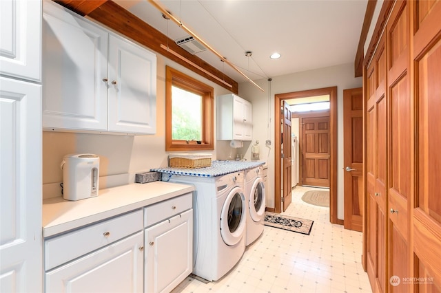 308 De Haro Ln, San Juan Island, WA 98250 - washroom featuring cabinet space, recessed lighting, light floors, visible vents, and washing machine and dryer