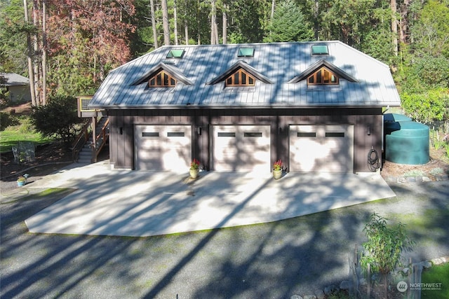 308 De Haro Ln, San Juan Island, WA 98250 - garage with driveway and a detached garage