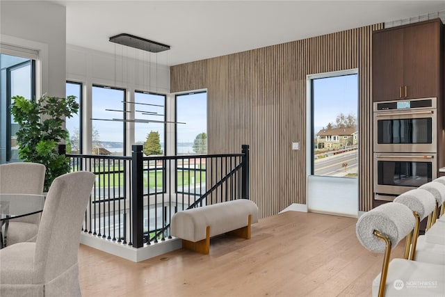 bedroom featuring multiple windows and light wood-type flooring