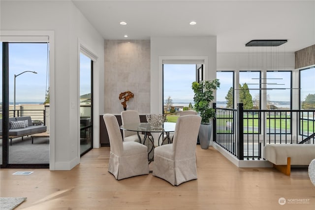 dining space with light wood-type flooring