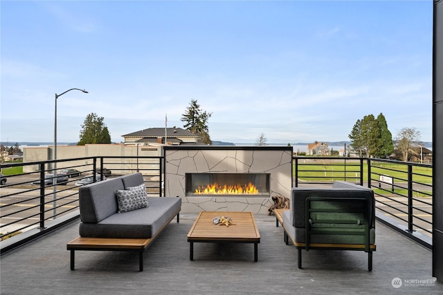 view of patio / terrace featuring exterior fireplace