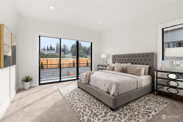 carpeted bedroom with access to exterior