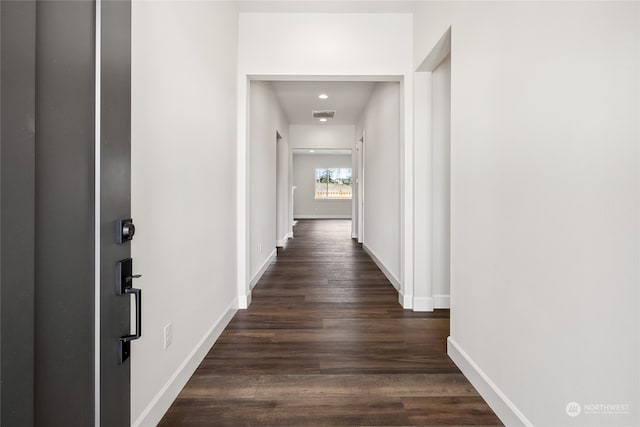 hall with dark wood-type flooring