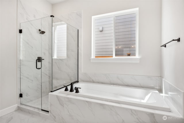 bathroom featuring separate shower and tub