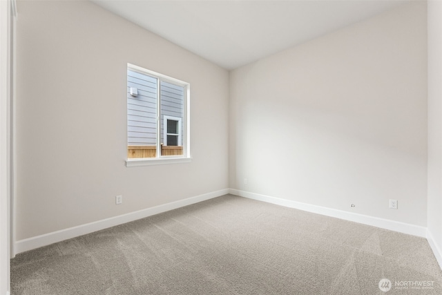 spare room with carpet floors and baseboards