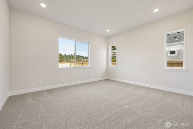 unfurnished room with baseboards, carpet floors, and recessed lighting