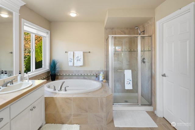 bathroom with vanity, separate shower and tub, and tile patterned flooring