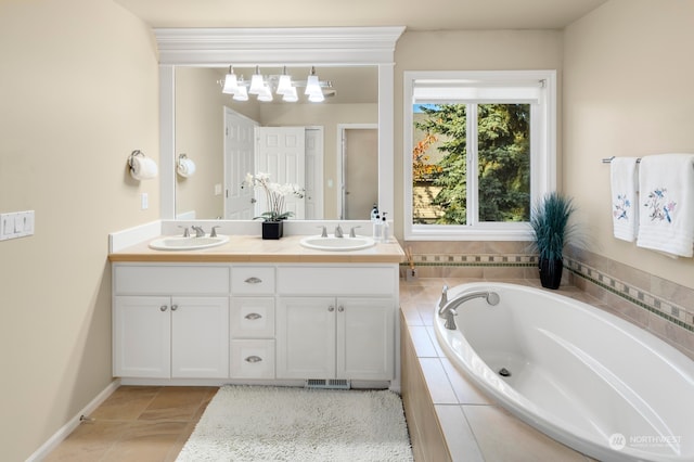 bathroom featuring vanity and a relaxing tiled tub