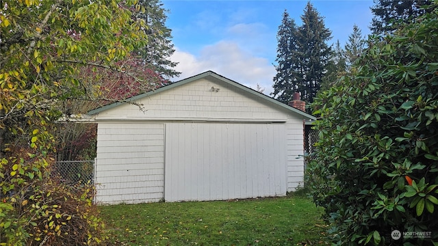 garage with a yard