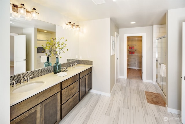 bathroom with vanity and an enclosed shower