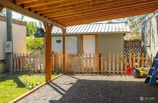 view of patio with a storage unit