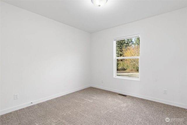 empty room featuring carpet flooring