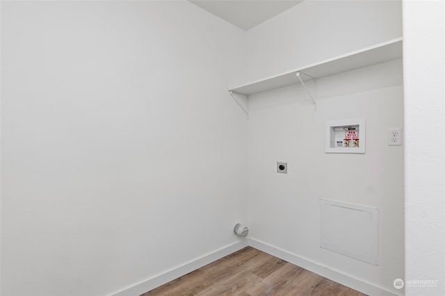 washroom with hookup for a washing machine, hookup for an electric dryer, and light wood-type flooring