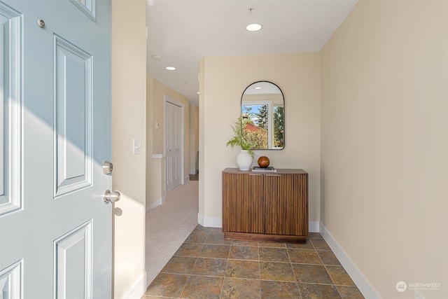 interior space with dark colored carpet