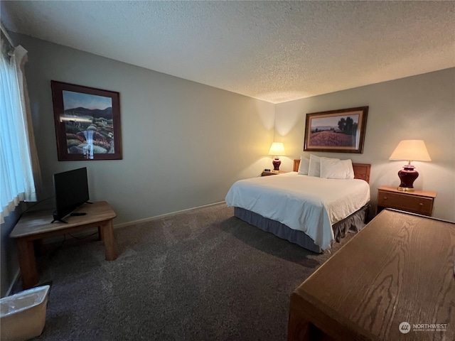 carpeted bedroom featuring a textured ceiling