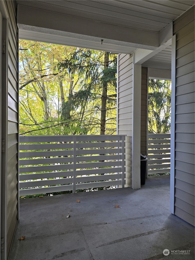 doorway to outside featuring wooden walls