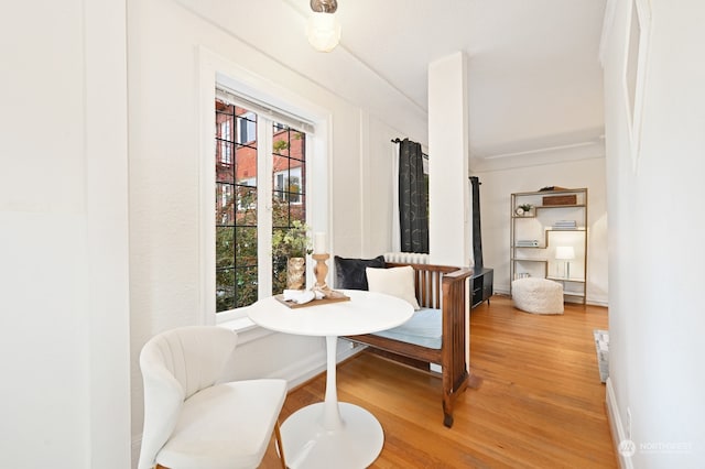 dining space featuring breakfast area and hardwood / wood-style flooring