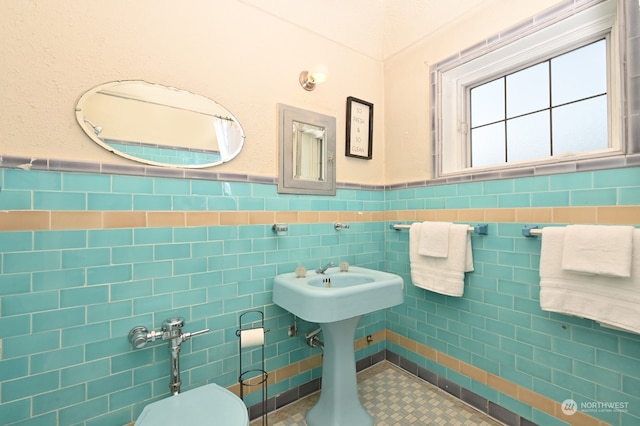 bathroom with tile walls and toilet