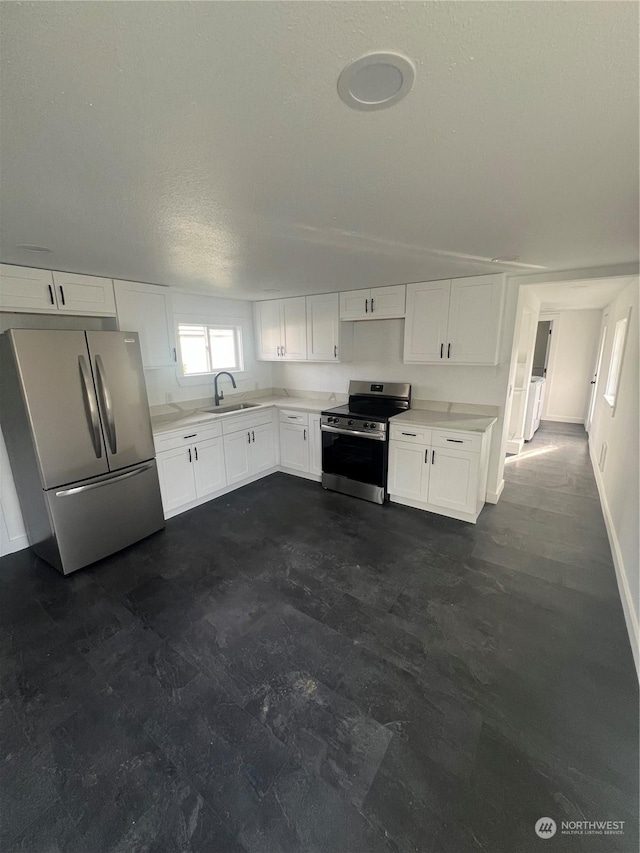 kitchen with white cabinets, sink, and stainless steel appliances