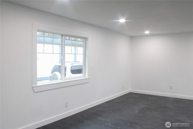 unfurnished room with dark wood-style flooring, recessed lighting, and baseboards