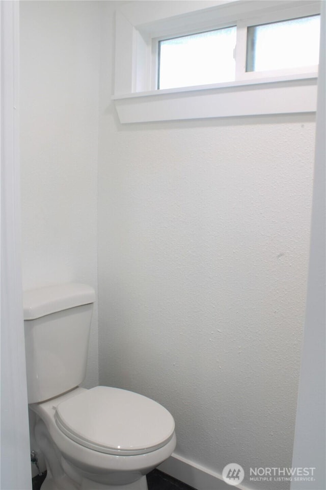 bathroom featuring toilet