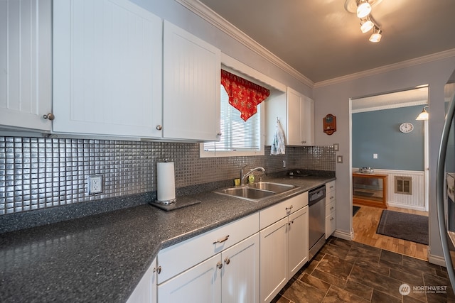 kitchen with ornamental molding, dark hardwood / wood-style floors, sink, white cabinets, and dishwasher