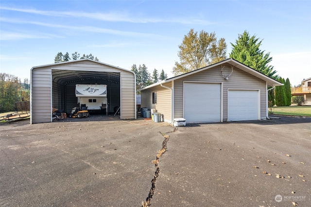 garage featuring a carport