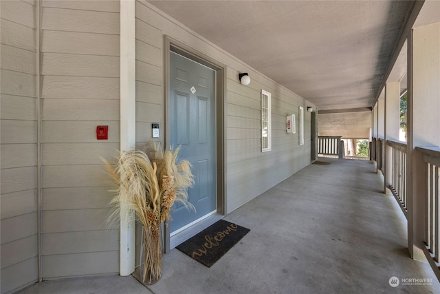 property entrance with covered porch