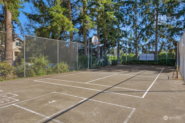 view of sport court featuring basketball hoop