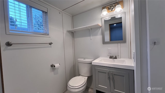 bathroom with toilet and vanity