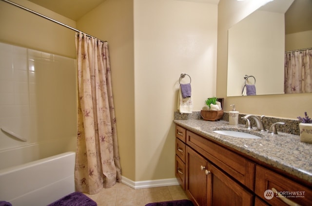 bathroom featuring tile patterned flooring, vanity, and shower / bath combo with shower curtain