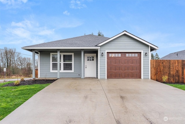 single story home with covered porch and a garage