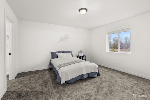 bedroom featuring dark carpet