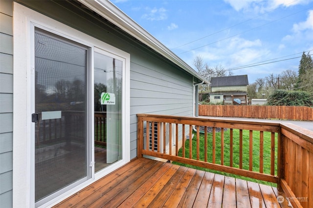 wooden deck with a yard