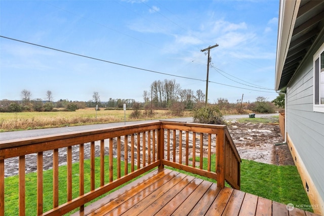 wooden terrace with a yard