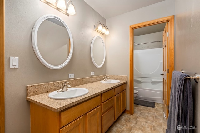 full bathroom featuring vanity, shower / bathtub combination, and toilet