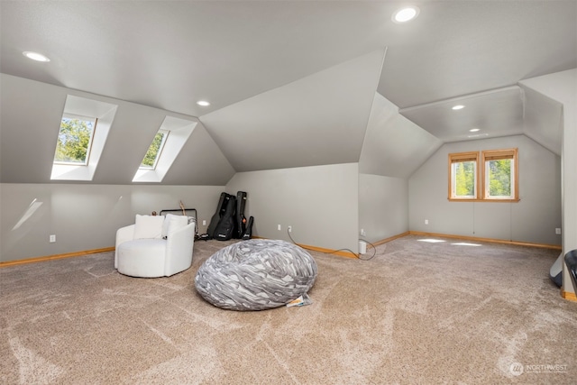 additional living space with vaulted ceiling, carpet floors, and a wealth of natural light