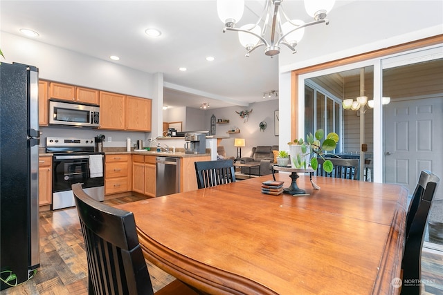 dining room featuring an inviting chandelier and dark hardwood / wood-style floors