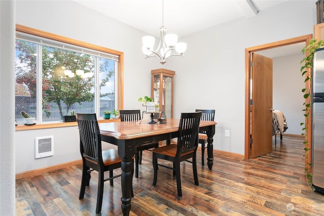 dining space featuring dark wood-type flooring, beamed ceiling, heating unit, and an inviting chandelier