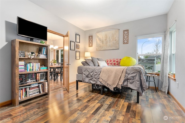 bedroom with hardwood / wood-style floors