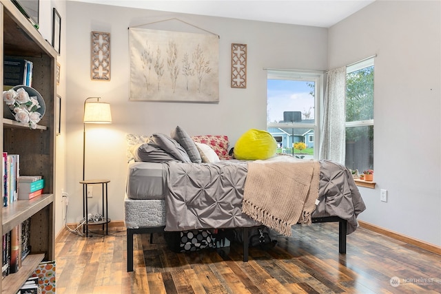 bedroom with hardwood / wood-style flooring