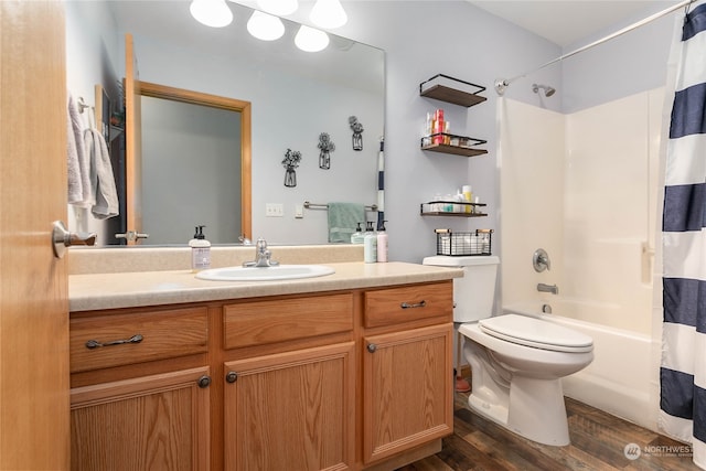 full bathroom featuring vanity, hardwood / wood-style floors, toilet, and shower / bathtub combination with curtain