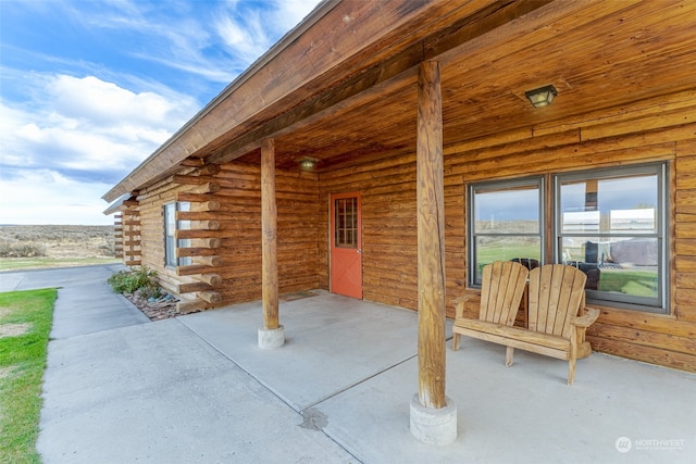 view of patio featuring a porch