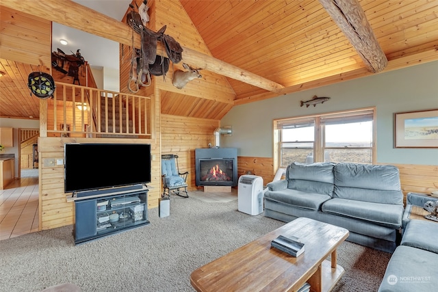 living room with wood ceiling, lofted ceiling with beams, wooden walls, and carpet flooring