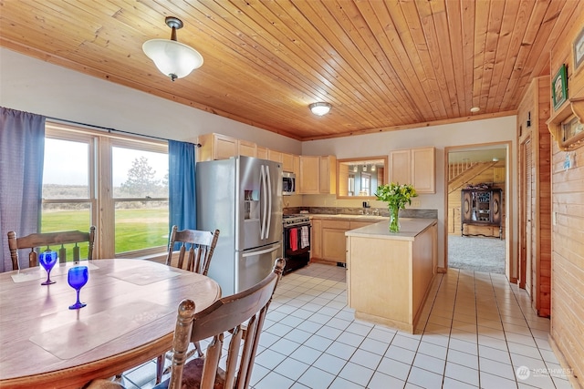 kitchen featuring light tile patterned floors, wooden ceiling, light brown cabinetry, pendant lighting, and stainless steel appliances