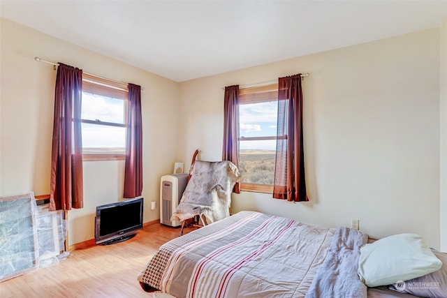 bedroom with light hardwood / wood-style floors