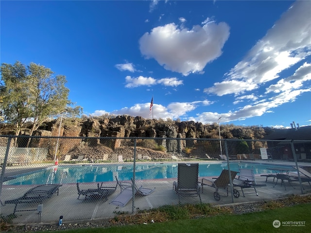 view of swimming pool featuring a patio