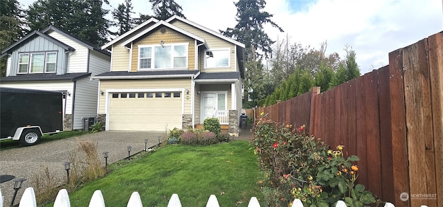 view of front of house featuring a front lawn and a garage